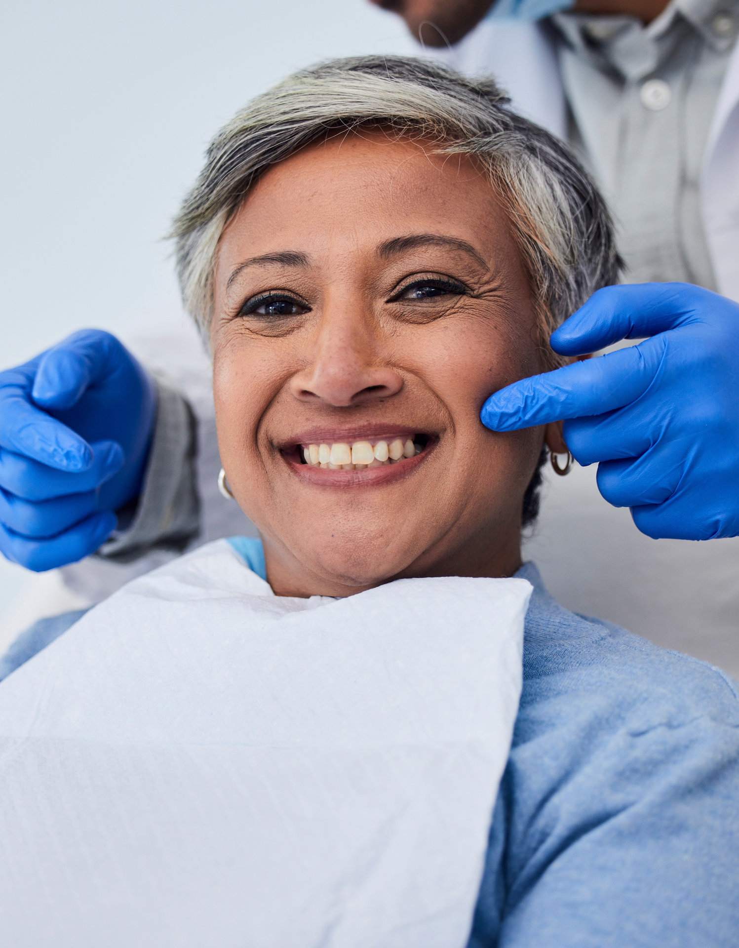 Happy senior woman, teeth and dentist for dental care, appointment or checkup at clinic. Portrait of elderly female person smile for tooth whitening, cleaning or oral, mouth and gum care at hospital