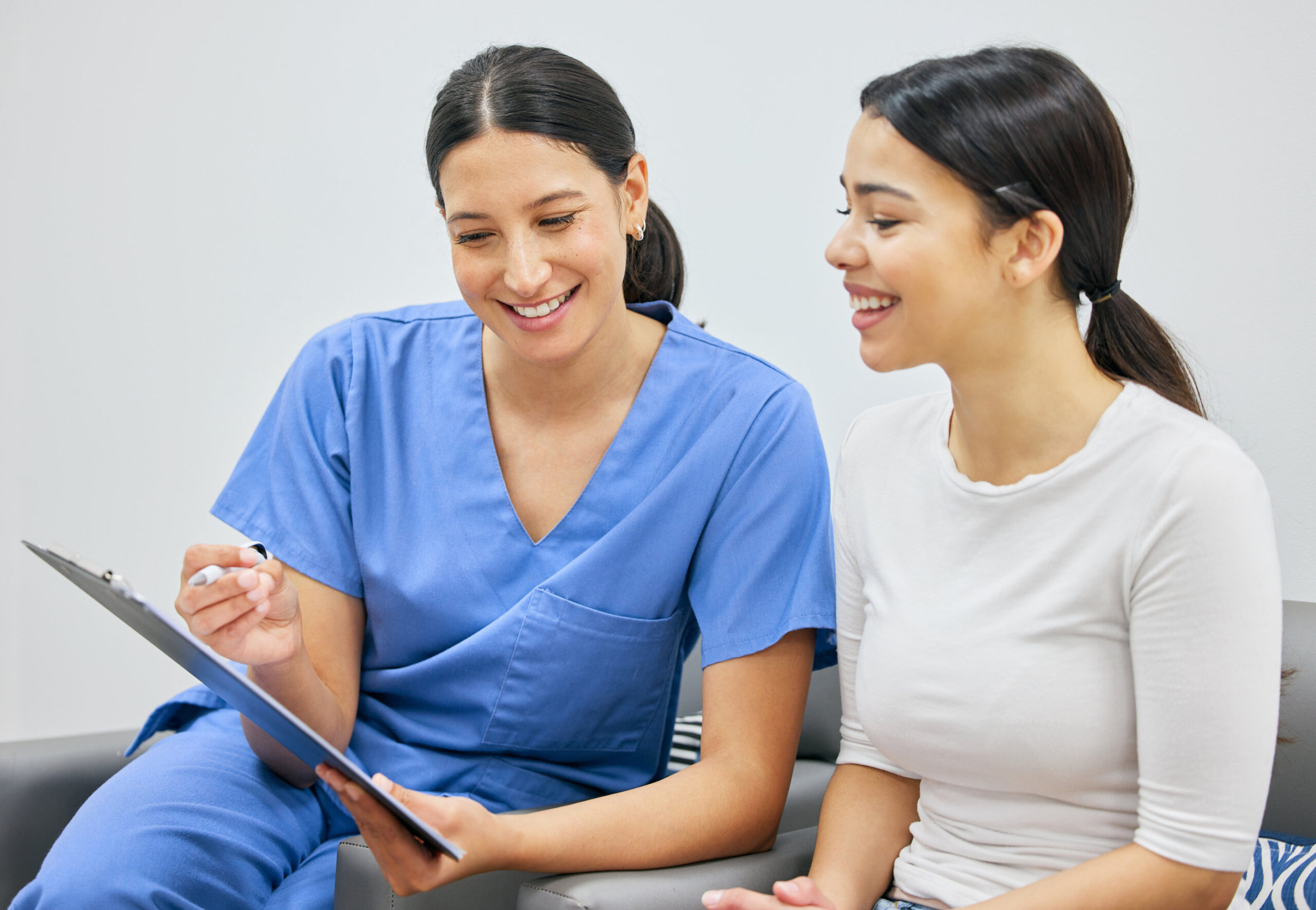 People, women and doctor with clipboard for document or insurance compliance and consultation in clinic. Female patient, healthcare and dentist with paperwork results for oral exam and conversation.