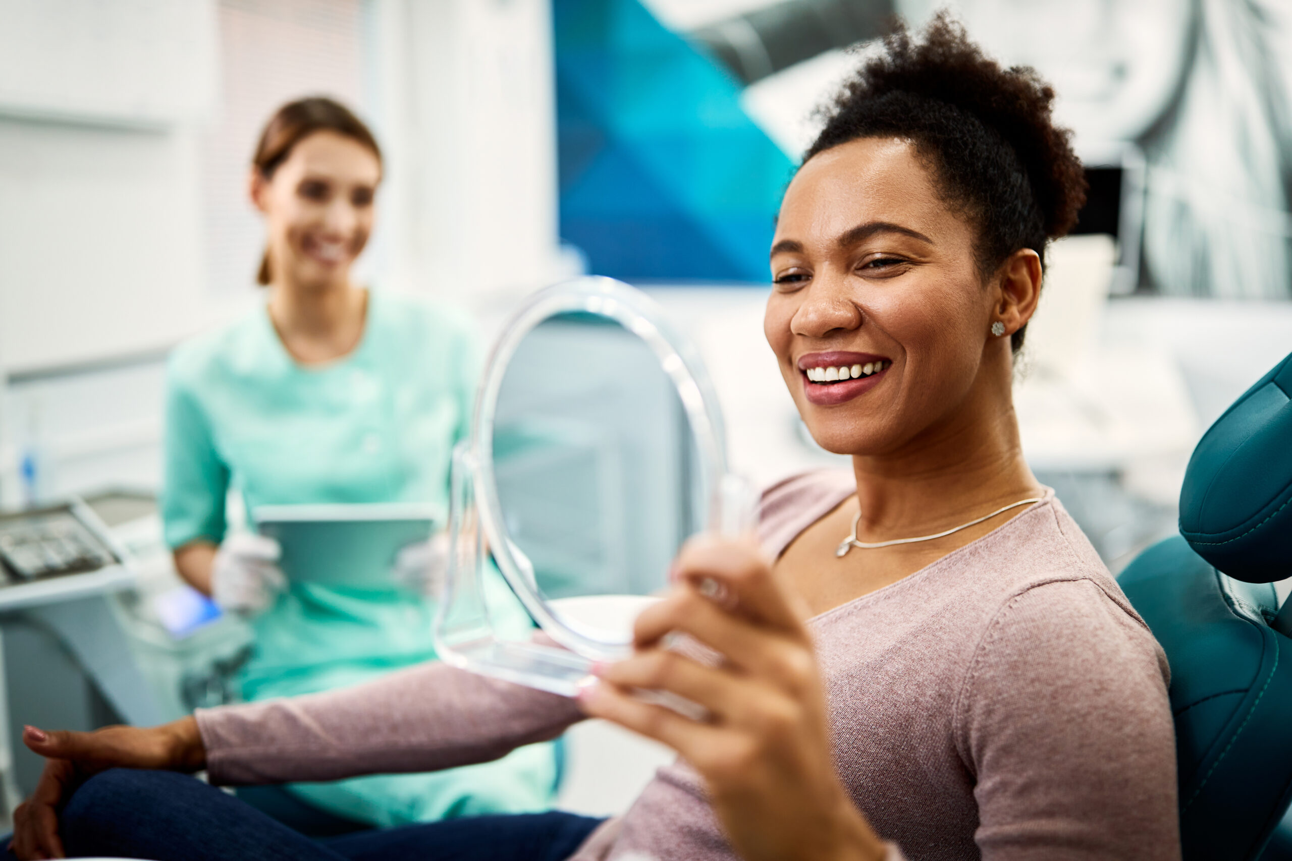 Patient smiling after dental treatment at Haratz Dental